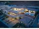Expansive three-story home featuring balconies, a pool with a spa, manicured grounds and a large driveway at 1683 Tangiers Dr, Henderson, NV 89012