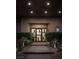 Beautiful front entrance with custom door, manicured shrubs, and desert landscaping at 1683 Tangiers Dr, Henderson, NV 89012