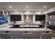 Bright, open kitchen featuring an island with seating and stainless steel appliances and dark wood cabinets at 1683 Tangiers Dr, Henderson, NV 89012