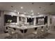 Open kitchen with an island with seating, stainless steel appliances, dark wood cabinets, and pendant lighting at 1683 Tangiers Dr, Henderson, NV 89012