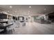 Open-concept living area with kitchen island, dining area, and spacious seating with fireplace and media center at 1683 Tangiers Dr, Henderson, NV 89012