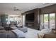 Stylish living room featuring a fireplace, media center, comfortable seating, and outdoor view at 1683 Tangiers Dr, Henderson, NV 89012