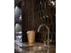 Close-up of a wet bar with high-end finishes, including stylish backsplash and modern faucet at 1683 Tangiers Dr, Henderson, NV 89012