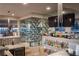 Entertainer's wet bar features custom shelving, lighting, and bar seating near wine storage at 1683 Tangiers Dr, Henderson, NV 89012
