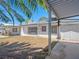 Backyard with partial grass and a covered patio; an ideal space for relaxing and enjoying time outdoors at 1704 S 8Th St, Las Vegas, NV 89104