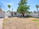 Backyard with covered patio, lounge seating, and a palm tree at 1704 S 8Th St, Las Vegas, NV 89104
