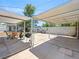 This spacious backyard features a covered patio with seating, BBQ and mature trees at 1704 S 8Th St, Las Vegas, NV 89104
