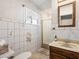 Bathroom features vintage wall tile, vanity, and a shower at 1704 S 8Th St, Las Vegas, NV 89104