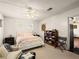 Bright bedroom with white walls, comfortable bed, and a storage unit with linens at 1704 S 8Th St, Las Vegas, NV 89104
