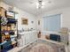 Bedroom featuring carpet and area rug, white walls, ceiling fan and abundant storage at 1704 S 8Th St, Las Vegas, NV 89104