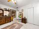 This bedroom features neutral walls, carpeted floors, ceiling fan and traditional wood dresser at 1704 S 8Th St, Las Vegas, NV 89104