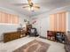 Cozy bedroom with natural light, soft carpet, and a ceiling fan at 1704 S 8Th St, Las Vegas, NV 89104
