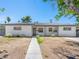 Charming single-story home featuring stucco walls, mature trees and gated access at 1704 S 8Th St, Las Vegas, NV 89104