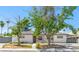 Charming single-story home featuring stucco walls, mature trees and gated access at 1704 S 8Th St, Las Vegas, NV 89104