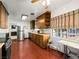This lovely kitchen features wood cabinets, a stainless steel refrigerator, and updated appliances at 1704 S 8Th St, Las Vegas, NV 89104