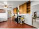 Cozy kitchen featuring wooden cabinets, stainless steel appliances, and hardwood flooring at 1704 S 8Th St, Las Vegas, NV 89104