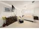 This relaxing main bedroom features a ceiling fan, a dresser, and a mounted television at 1704 S 8Th St, Las Vegas, NV 89104
