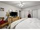 Spacious main bedroom featuring a ceiling fan, large dresser and sliding door closet at 1704 S 8Th St, Las Vegas, NV 89104