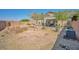 This backyard features desert landscaping and a built in fire pit at 1740 Flores Ln, Henderson, NV 89012