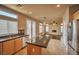 Modern kitchen featuring granite countertops, stainless appliances and island bar at 1740 Flores Ln, Henderson, NV 89012