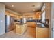 Well-appointed kitchen features granite countertops, stainless steel appliances, and center island at 1740 Flores Ln, Henderson, NV 89012