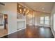 Open-concept living area featuring hardwood floors and staircase at 1740 Flores Ln, Henderson, NV 89012