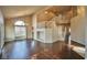 Expansive living room features vaulted ceilings, hardwood floors, and a beautiful staircase at 1740 Flores Ln, Henderson, NV 89012