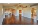 Spacious living room features hardwood floors and an open floor plan with fireplace at 1740 Flores Ln, Henderson, NV 89012