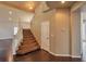 Elegant foyer showcases a staircase with carpeted steps and a white wooden banister at 1740 Flores Ln, Henderson, NV 89012