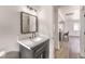 Gray vanity with white countertop and mirror in a bright bathroom at 1804 Pacific St, Las Vegas, NV 89104