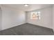 A bright bedroom with soft carpeting and a window offering a view of the outside at 1804 Pacific St, Las Vegas, NV 89104