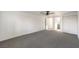 Spacious primary bedroom with a ceiling fan, plush carpet and ensuite bath at 1804 Pacific St, Las Vegas, NV 89104