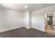 Spacious bedroom featuring soft carpeted floors and access to the hallway at 1804 Pacific St, Las Vegas, NV 89104