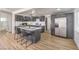 Bright kitchen with stainless appliances, gray cabinets and an island with bar seating at 1804 Pacific St, Las Vegas, NV 89104