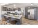 Eat-in kitchen features stainless appliances, gray cabinets, and bar seating at 1804 Pacific St, Las Vegas, NV 89104