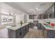 Stylish kitchen with gray cabinets, stainless appliances and an island with bar seating at 1804 Pacific St, Las Vegas, NV 89104