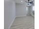 Large bedroom with neutral walls, ceiling fan, and a window at 1825 Howard Ave, Las Vegas, NV 89104