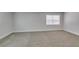 Spacious bedroom features a neutral color palette and plush carpeting at 1825 Howard Ave, Las Vegas, NV 89104