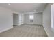 A spacious bedroom with neutral carpet and paint, recessed lighting and a window A/C unit at 1825 Howard Ave, Las Vegas, NV 89104