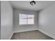 Carpeted bedroom with window providing natural light; great potential for personalization at 1825 Howard Ave, Las Vegas, NV 89104