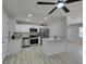 Modern kitchen featuring stainless steel appliances, white cabinetry, and quartz countertop at 1825 Howard Ave, Las Vegas, NV 89104