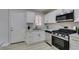 Modern kitchen features stainless appliances, white cabinets, and sleek hardware at 1825 Howard Ave, Las Vegas, NV 89104