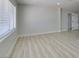 Bright living room with fresh paint, wood flooring, white trim and modern windows at 1825 Howard Ave, Las Vegas, NV 89104