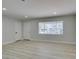 Bright living room with neutral walls, wood flooring, modern trim, and natural light at 1825 Howard Ave, Las Vegas, NV 89104