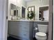 Bathroom vanity with granite countertop, stylish decor and decorative mirror at 1830 N Buffalo Dr # 2022, Las Vegas, NV 89128