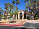 Inviting clubhouse featuring an arched entryway, desert landscaping, and subtle stone accents adding to its welcoming appearance at 1830 N Buffalo Dr # 2022, Las Vegas, NV 89128