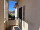 Inviting entryway with a sleek security door and neutral-colored stucco at 1830 N Buffalo Dr # 2022, Las Vegas, NV 89128