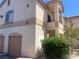 Charming condo featuring a private garage, a quaint balcony, and neat landscaping at 1830 N Buffalo Dr # 2022, Las Vegas, NV 89128