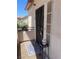 Exterior view of the front door with security gate and decorative welcome mat at 1830 N Buffalo Dr # 2022, Las Vegas, NV 89128
