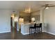 Kitchen featuring a breakfast bar, track lighting, and an open floor plan at 1830 N Buffalo Dr # 2022, Las Vegas, NV 89128
